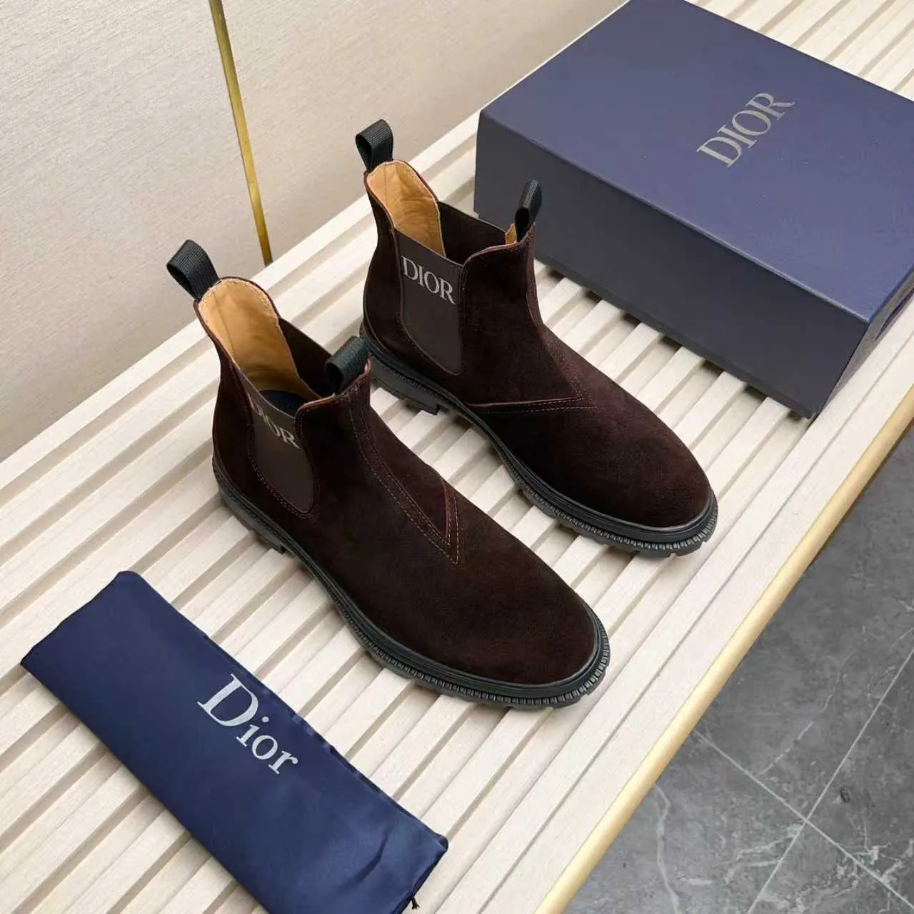 Men's Shoes 💰480 Dior A practical choice that combines protection with classic style. Made from durable Rugged Calf leather, it's tumbled and hand-finished to create a soft suede feel with a rich texture. Elastic side panels and subtle cutouts are inspired by the classic Chelsea boot. Leather upper and lining with Kummel tabs at front and rear, rubber outsole